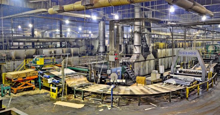 Wood-products production equipment and conveyors inside a Boise Cascade mill.