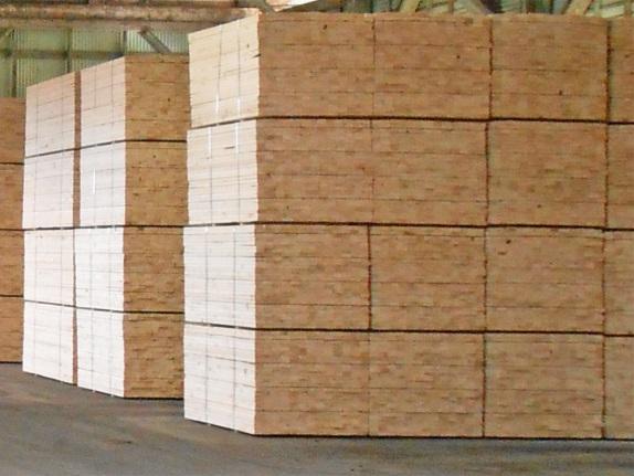 Bundled wood panels stacked for storage at Boise Cascade.