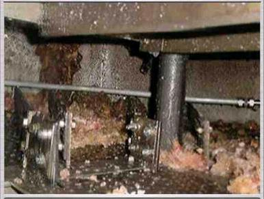 Polymer buildup on the internal trays of a distillation column.