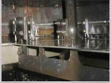 Distillation-column internals with trays and a central shaft visible.